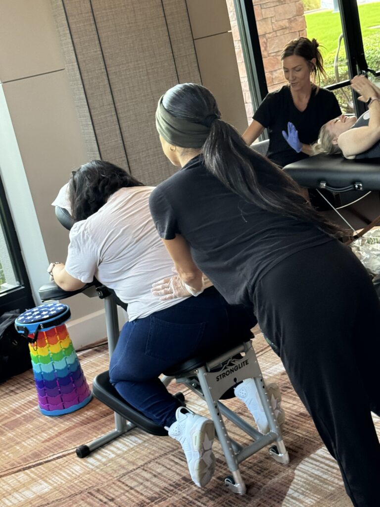 A woman receives a hairstyle makeover from another woman in a salon setting, showcasing a moment of beauty and care.