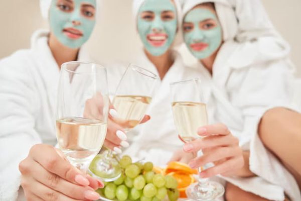 female-friends-drinking-wine-bed_651396-808 (1)